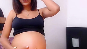 beautiful pregnant latina with wonderful belly and contractions